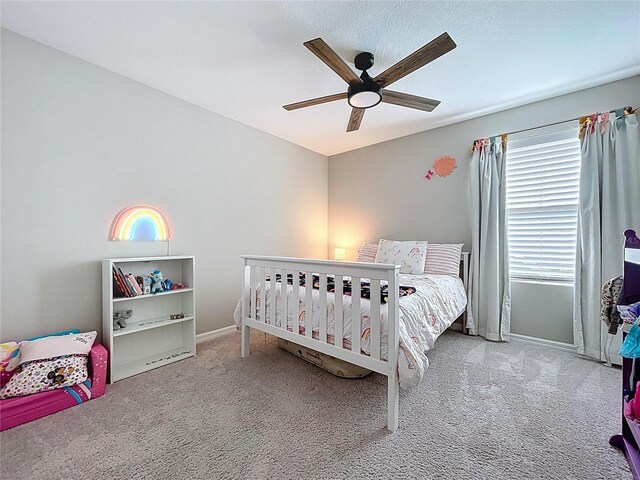 12832 Oak Hill Way, Parrish, FL 34219 - carpeted bedroom with baseboards and a ceiling fan