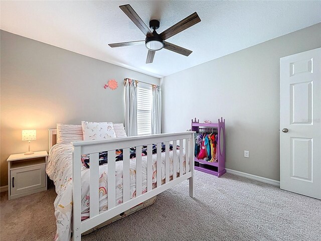 12832 Oak Hill Way, Parrish, FL 34219 - carpeted bedroom featuring baseboards and a ceiling fan