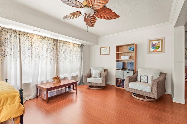 20 Idle Sands Dr, Venice, FL 34293 - living area with a ceiling fan, ornamental molding, wood finished floors, and a textured ceiling