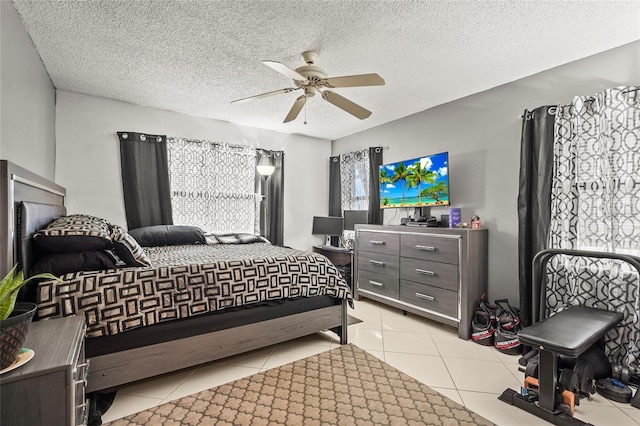 20 Idle Sands Dr, Venice, FL 34293 - bedroom featuring light tile patterned floors, a ceiling fan, and a textured ceiling