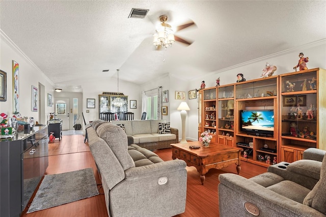 20 Idle Sands Dr, Venice, FL 34293 - living room featuring a ceiling fan, crown molding, a textured ceiling, wood finished floors, and vaulted ceiling