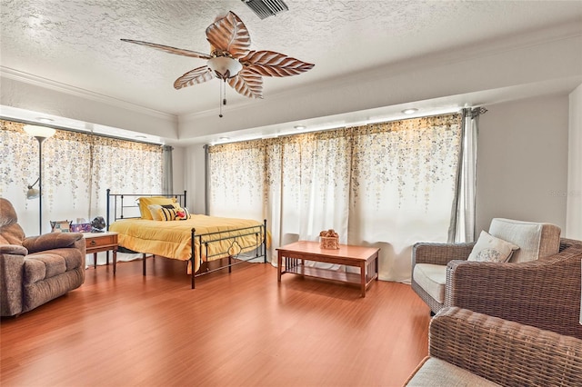 20 Idle Sands Dr, Venice, FL 34293 - bedroom featuring wood finished floors, crown molding, and a textured ceiling
