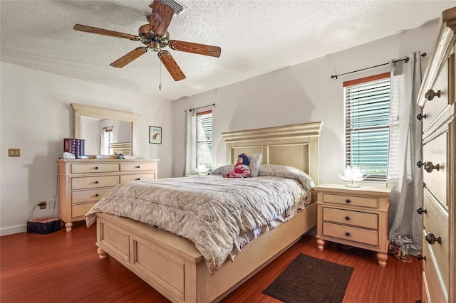 20 Idle Sands Dr, Venice, FL 34293 - bedroom with a textured ceiling, dark wood-type flooring, and ceiling fan