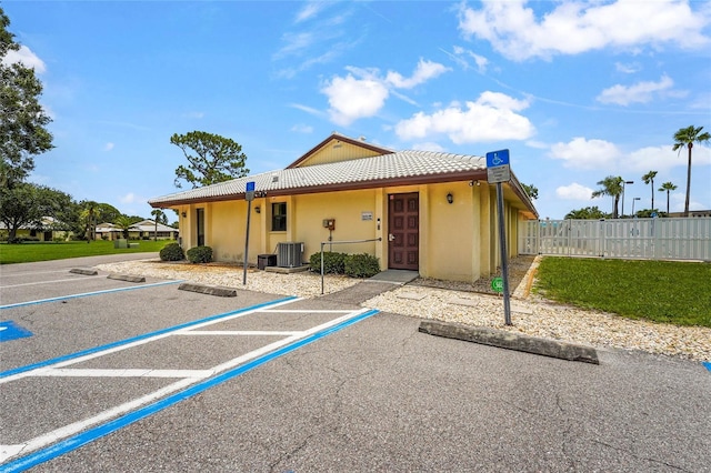 20 Idle Sands Dr, Venice, FL 34293 - view of front facade with a tiled roof, uncovered parking, and stucco siding