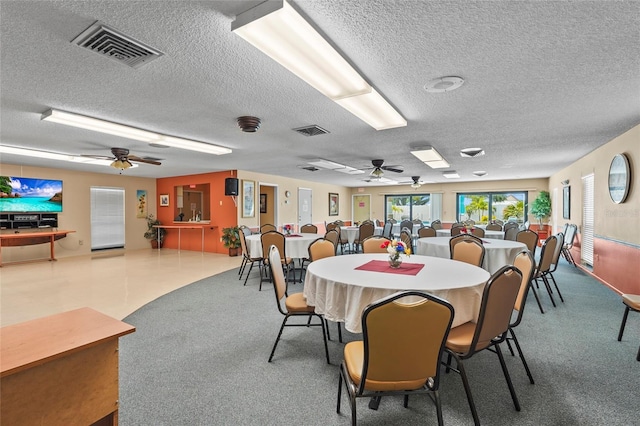 20 Idle Sands Dr, Venice, FL 34293 - dining space featuring a textured ceiling, a ceiling fan, and carpet