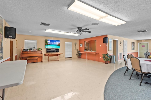 20 Idle Sands Dr, Venice, FL 34293 - dining room with a textured ceiling and a ceiling fan