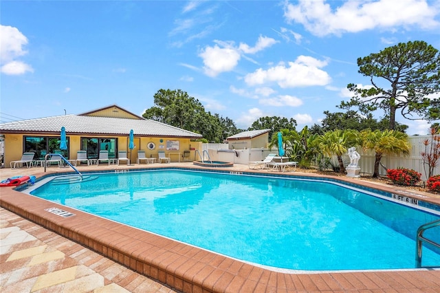 20 Idle Sands Dr, Venice, FL 34293 - community pool featuring a patio area and a fenced backyard