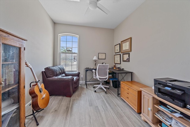 5523 Secluded Oaks Way, Sarasota, FL 34233 - office area featuring a ceiling fan and light wood-type flooring