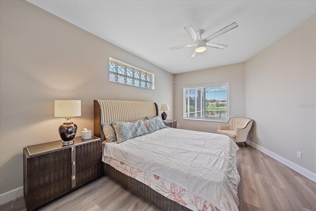 5523 Secluded Oaks Way, Sarasota, FL 34233 - bedroom featuring light wood-style flooring and ceiling fan