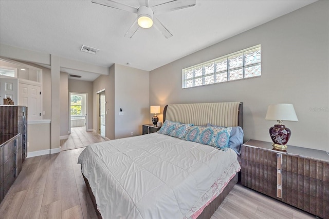 5523 Secluded Oaks Way, Sarasota, FL 34233 - bedroom featuring wood finished floors and ceiling fan