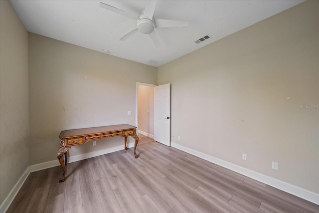 5523 Secluded Oaks Way, Sarasota, FL 34233 - unfurnished bedroom featuring wood finished floors and ceiling fan