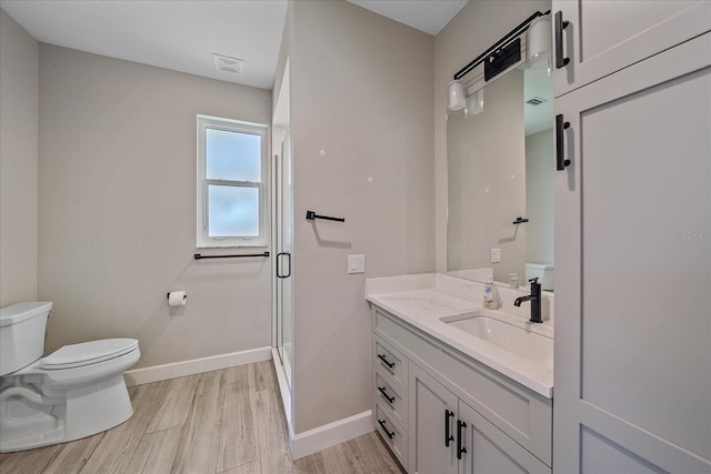 5523 Secluded Oaks Way, Sarasota, FL 34233 - full bath with vanity, wood finished floors, and a shower stall