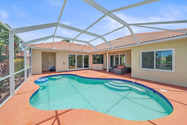 5523 Secluded Oaks Way, Sarasota, FL 34233 - swimming pool featuring a patio, a ceiling fan, and glass enclosure