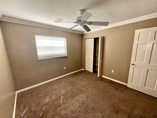 5615 Waneta Pl, Sarasota, FL 34231 - unfurnished bedroom featuring ornamental molding, carpet flooring, a closet, and ceiling fan