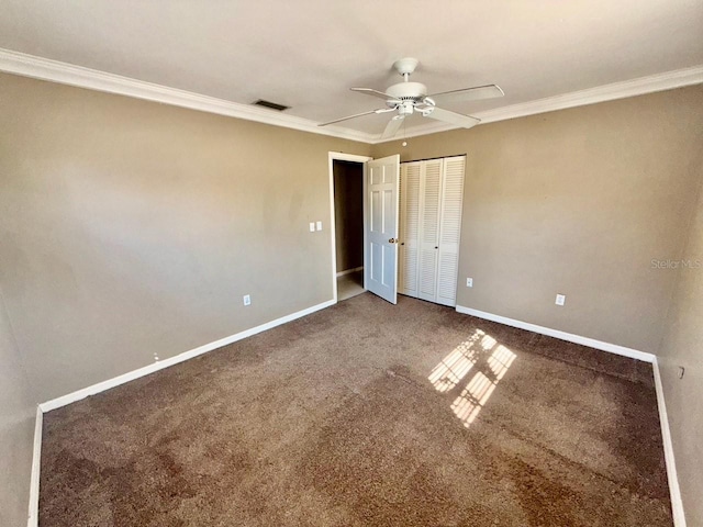 5615 Waneta Pl, Sarasota, FL 34231 - unfurnished bedroom featuring crown molding, carpet floors, a closet, and ceiling fan
