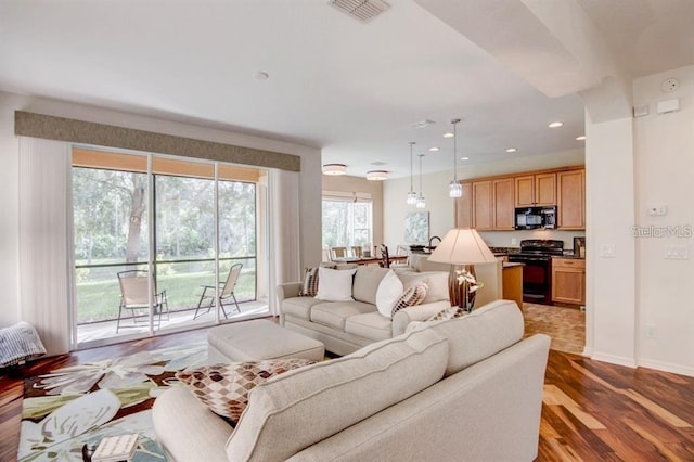 8168 Villa Grande Ct, Sarasota, FL 34243 - living area with wood finished floors and recessed lighting