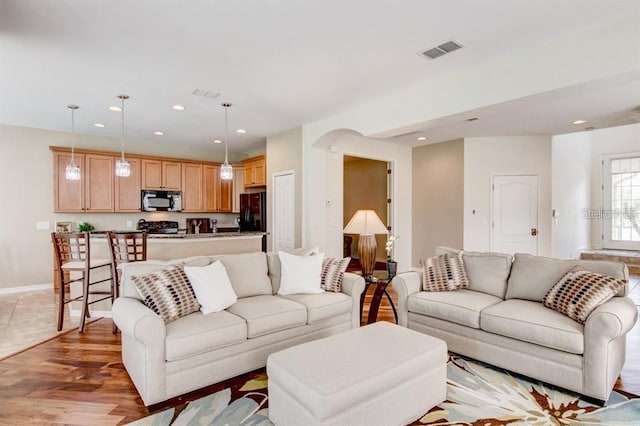 8168 Villa Grande Ct, Sarasota, FL 34243 - living area with recessed lighting, light wood-type flooring, and arched walkways