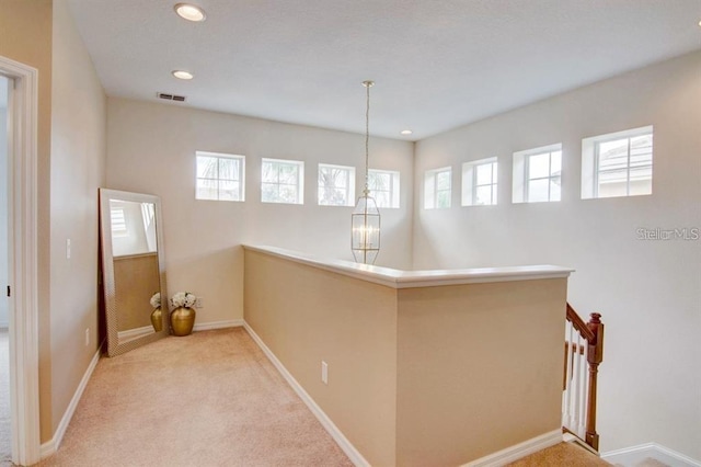 8168 Villa Grande Ct, Sarasota, FL 34243 - hall featuring carpet flooring, an upstairs landing, and recessed lighting