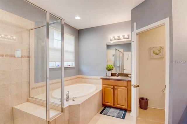 8168 Villa Grande Ct, Sarasota, FL 34243 - bathroom with vanity, tile patterned flooring, a bath, a stall shower, and recessed lighting