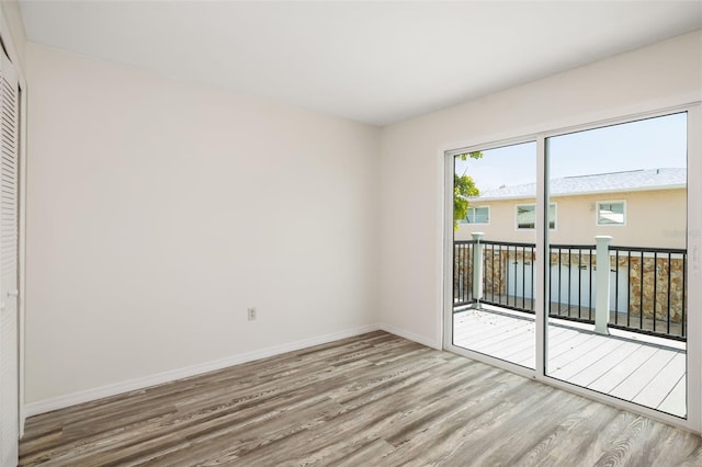 2513 Avenue B Ave B, Unit B, Bradenton Beach, FL 34217 - spare room featuring wood finished floors
