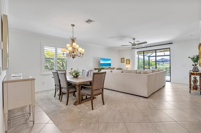 6507 Clairborne Ln, Bradenton, FL 34211 - dining room featuring light tile patterned flooring, healthy amount of natural light, a chandelier, crown molding, and ceiling fan