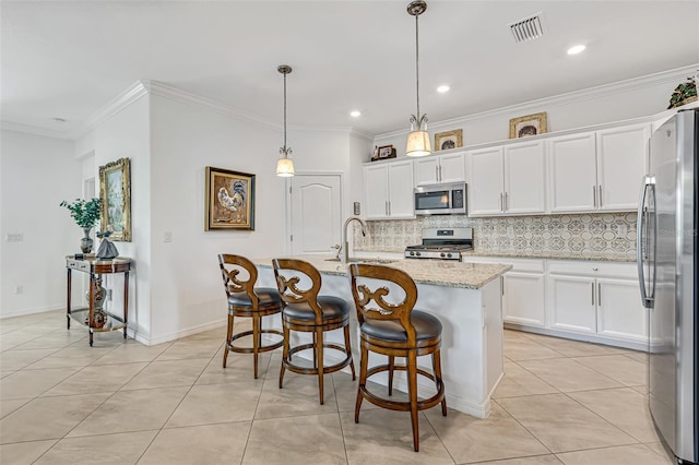 6507 Clairborne Ln, Bradenton, FL 34211 - kitchen with stainless steel appliances, backsplash, white cabinetry, crown molding, and light tile patterned flooring