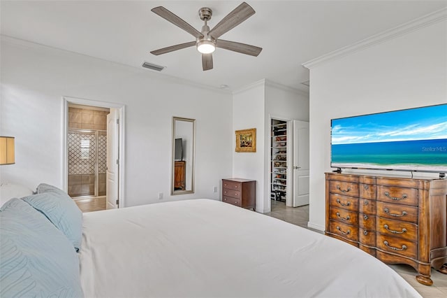 6507 Clairborne Ln, Bradenton, FL 34211 - bedroom with ornamental molding, a ceiling fan, tile patterned flooring, ensuite bath, and a walk in closet
