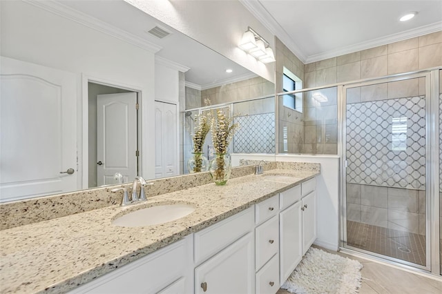 6507 Clairborne Ln, Bradenton, FL 34211 - bathroom featuring crown molding, double vanity, a shower stall, and tile patterned flooring