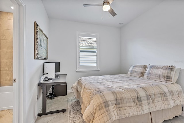 6507 Clairborne Ln, Bradenton, FL 34211 - bedroom with light tile patterned floors, ensuite bath, and a ceiling fan
