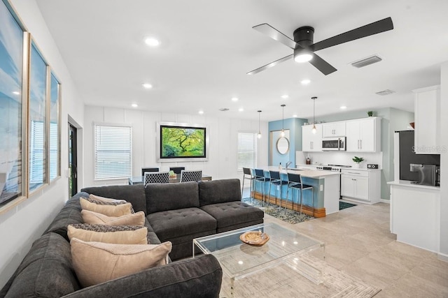 6563 Silverstar Dr, Sarasota, FL 34240 - living area featuring a ceiling fan and recessed lighting