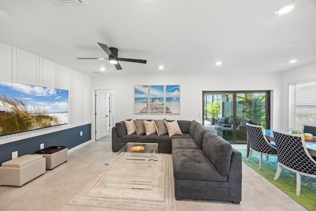 6563 Silverstar Dr, Sarasota, FL 34240 - living room with recessed lighting, healthy amount of natural light, light tile patterned floors, and a ceiling fan
