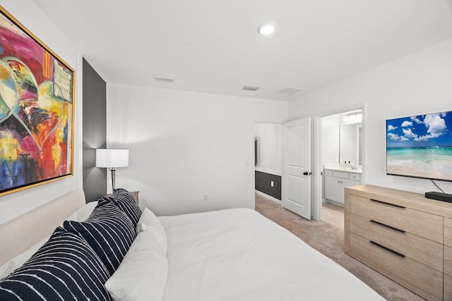 6563 Silverstar Dr, Sarasota, FL 34240 - bedroom with light carpet, ensuite bathroom, and recessed lighting