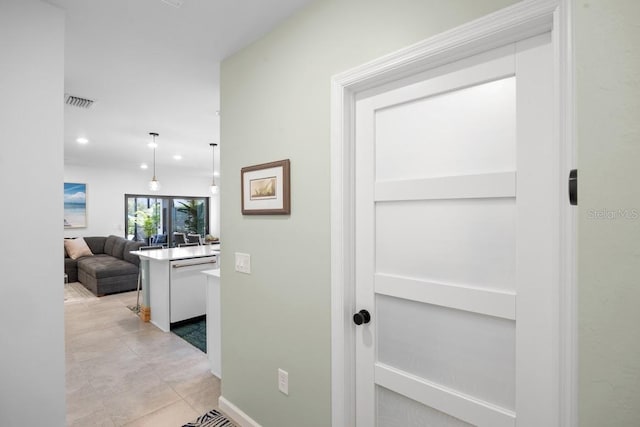 6563 Silverstar Dr, Sarasota, FL 34240 - hall featuring recessed lighting and light tile patterned flooring