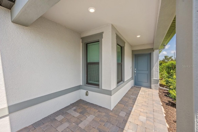 6563 Silverstar Dr, Sarasota, FL 34240 - view of exterior entry featuring stucco siding