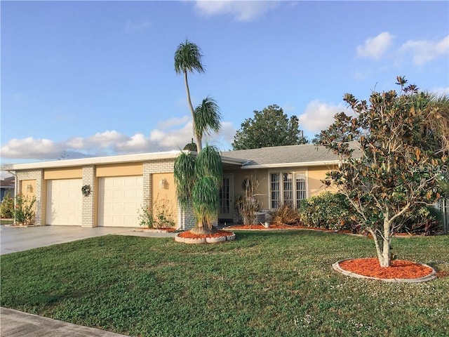 6004/6014 Deming Ave, North Port, FL 34287 - ranch-style home featuring driveway, a front yard, a garage, and brick siding