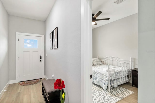 9417 Agate St, Port Charlotte, FL 33981 - foyer with wood finished floors, ceiling fan, and baseboards