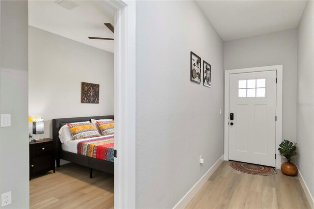 9417 Agate St, Port Charlotte, FL 33981 - entryway with wood finished floors, baseboards, and a ceiling fan