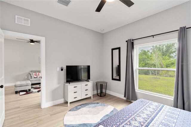 9417 Agate St, Port Charlotte, FL 33981 - bedroom featuring light wood-style flooring, baseboards, and a ceiling fan