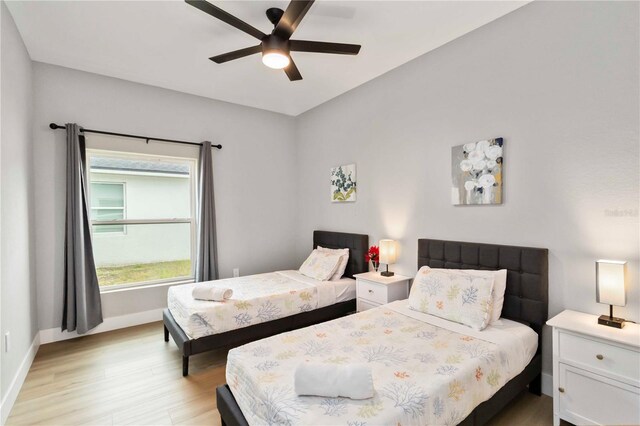 9417 Agate St, Port Charlotte, FL 33981 - bedroom with light wood-style flooring, baseboards, and ceiling fan