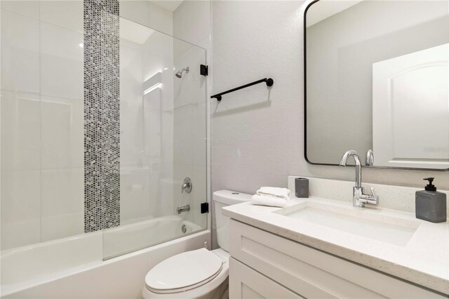 9417 Agate St, Port Charlotte, FL 33981 - bathroom with toilet, vanity, and shower / tub combination