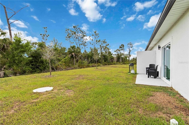 9417 Agate St, Port Charlotte, FL 33981 - view of grassy yard featuring a patio