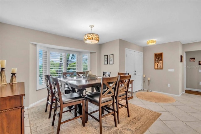 1461 Marlin St, Nokomis, FL 34275 - dining area featuring light tile patterned floors and baseboards