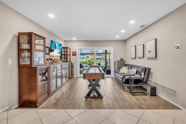 1461 Marlin St, Nokomis, FL 34275 - living area featuring wood finished floors, recessed lighting, and a bar
