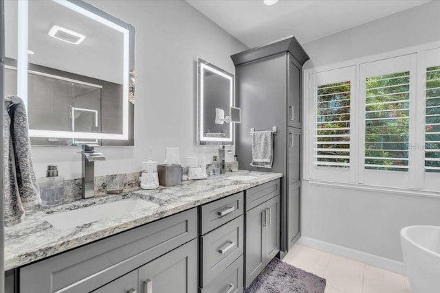 1461 Marlin St, Nokomis, FL 34275 - bathroom with double vanity, tile patterned floors, and a freestanding tub