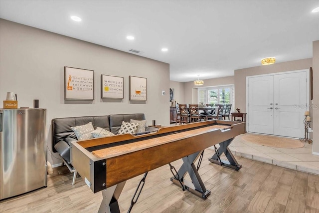 1461 Marlin St, Nokomis, FL 34275 - recreation room with light wood finished floors and recessed lighting