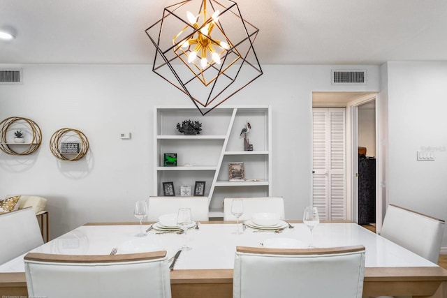 5600 Beach Way Dr Unit 315, Sarasota, FL 34242 - dining area with a chandelier