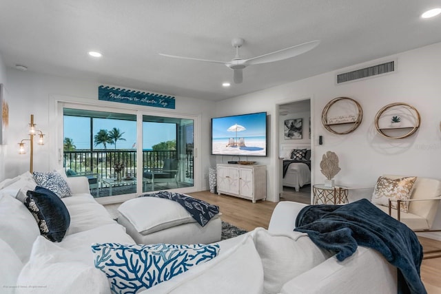 5600 Beach Way Dr Unit 315, Sarasota, FL 34242 - living area featuring ceiling fan, wood finished floors, and recessed lighting