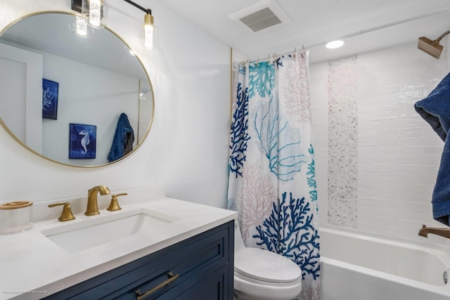 5600 Beach Way Dr Unit 315, Sarasota, FL 34242 - bathroom with vanity, shower / bath combo with shower curtain, and toilet