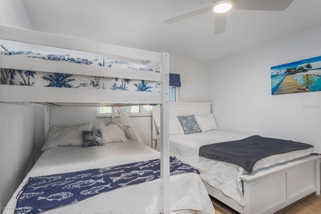 5600 Beach Way Dr Unit 315, Sarasota, FL 34242 - bedroom with ceiling fan and wood finished floors