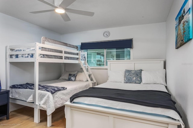5600 Beach Way Dr Unit 315, Sarasota, FL 34242 - bedroom featuring wood finished floors and a ceiling fan